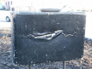 One of the suitcases that was also vandalised along with the sculpture.